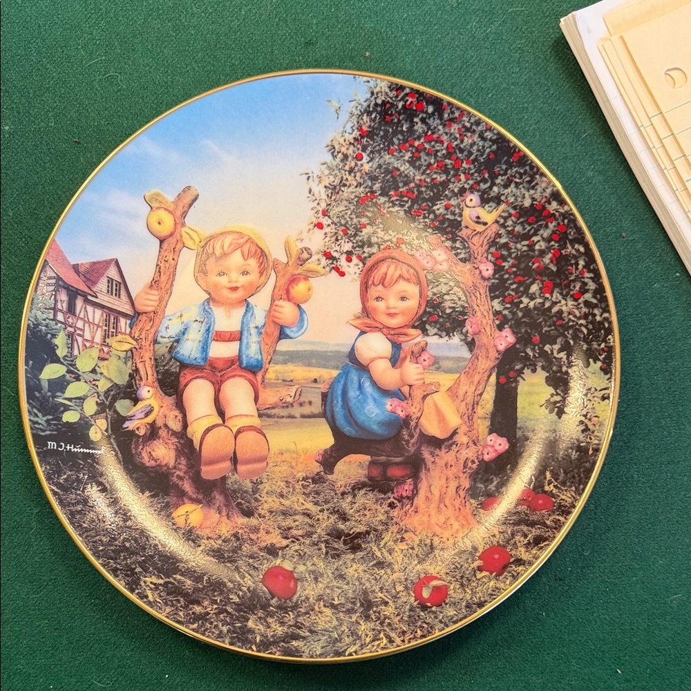 M. J. Hummel titled apple tree boy and girl.